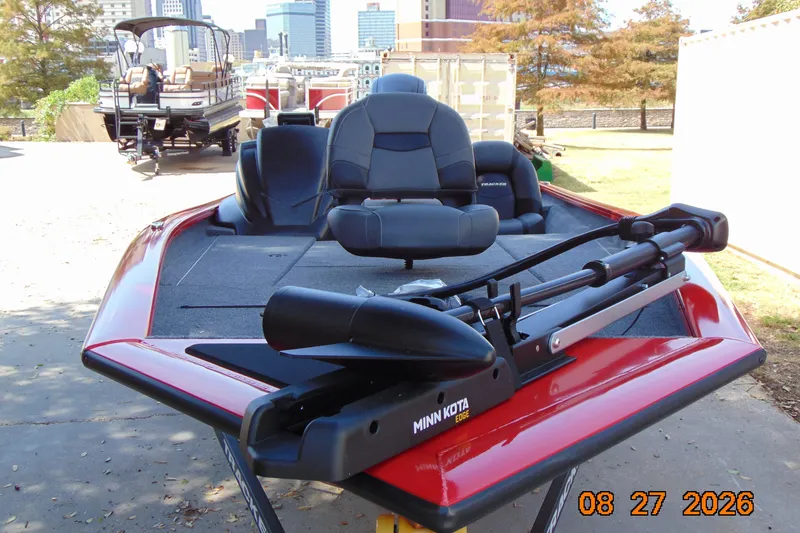 Slide: The Image of 2026 Tracker Pro Team 190 boat with Minn Kota motor, parked outdoors. - 67