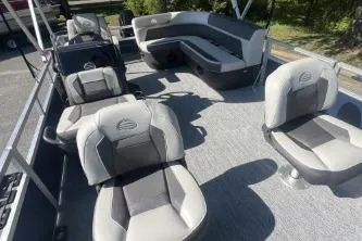 Slide: The Image of 2026 Sun Tracker Bass Buggy 16 XL Select pontoon boat interior with seating and helm. - 7