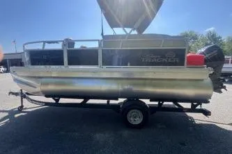 The Image of 2026 Sun Tracker Bass Buggy 16 XL Select pontoon boat on trailer, side view. - 0