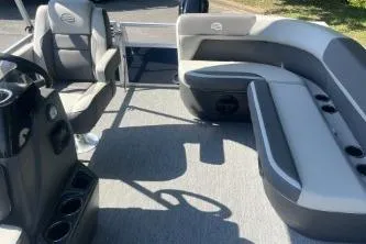 Slide: The Image of 2026 Sun Tracker Bass Buggy 16 XL Select pontoon boat interior with seating and console. - 4