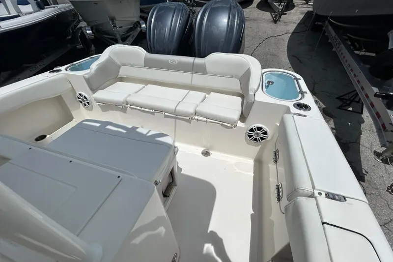 Slide: The Image of 2024 Key West 263 FS boat interior with seating and storage compartments. - 11
