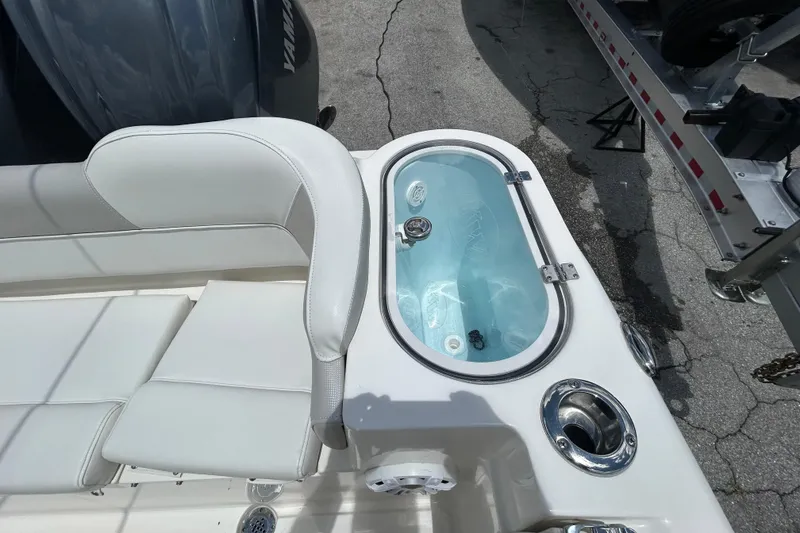 Slide: The Image of 2024 Key West 263 FS boat interior with seating and livewell. - 13