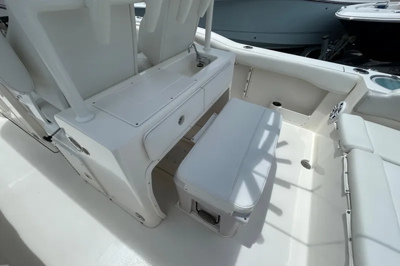 Slide: The Image of 2024 Key West 263 FS boat interior with seating and storage area. - 14