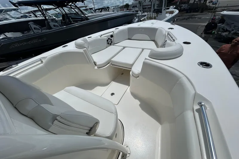 Slide: The Image of 2024 Key West 263 FS boat interior with white seating and spacious layout. - 16