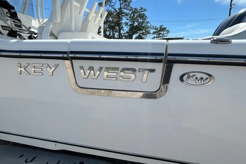 Slide: The Image of 2024 Key West 263 FS boat with logo and branding details. - 6
