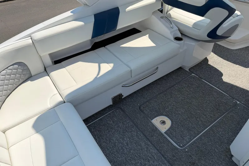 Slide: The Image of Interior seating of a 2012 Chaparral 327 SSX boat with white upholstery. - 14