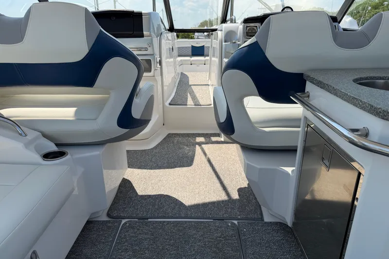 Slide: The Image of Interior of 2012 Chaparral 327 SSX boat with modern seating and kitchenette. - 24