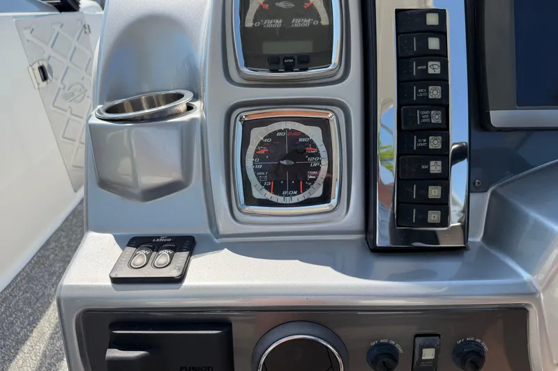 Slide: The Image of Dashboard of a 2012 Chaparral 327 SSX boat with gauges and controls. - 27