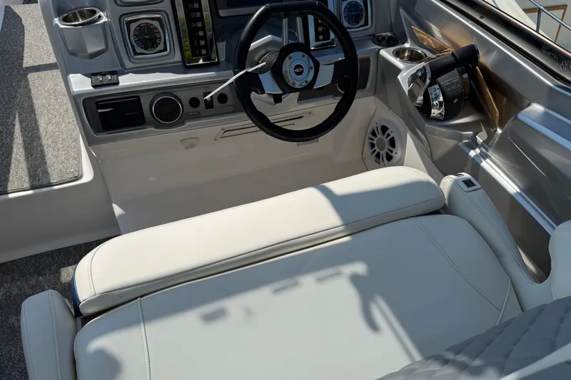 Slide: The Image of Interior cockpit of 2012 Chaparral 327 SSX boat with steering wheel and controls. - 30