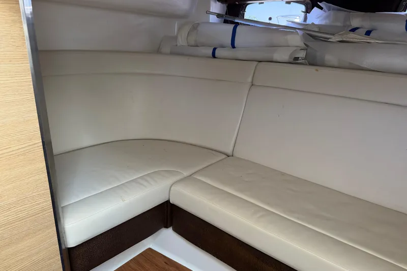 Slide: The Image of Interior seating of 2012 Chaparral 327 SSX boat with white upholstery. - 37