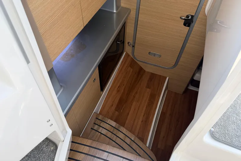 Slide: The Image of Interior of 2012 Chaparral 327 SSX boat with wood flooring and cabinetry. - 41
