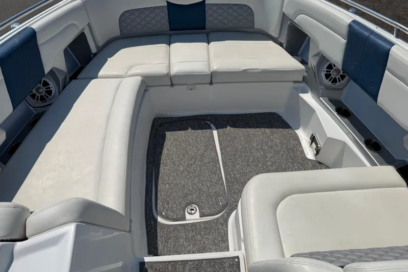 Slide: The Image of Interior seating of 2012 Chaparral 327 SSX boat with cushioned upholstery. - 44