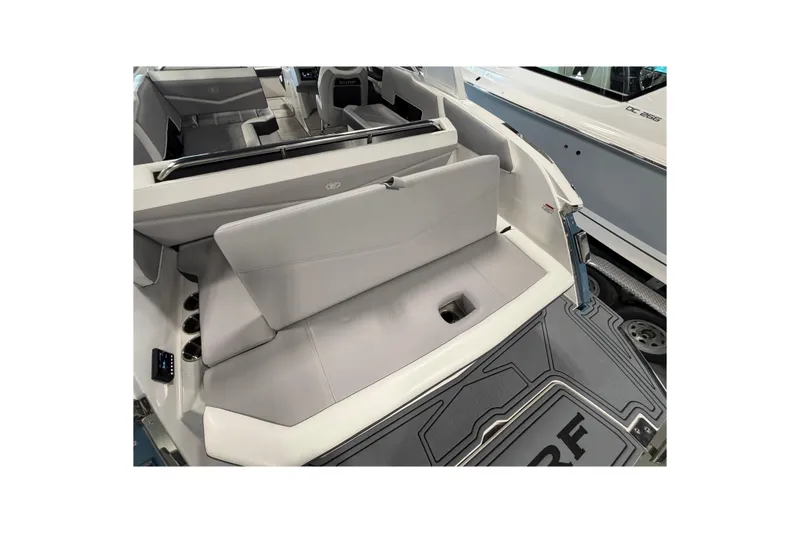 Slide: The Image of 2022 Cobalt R6 Surf boat interior with sleek gray seating and modern design. - 11