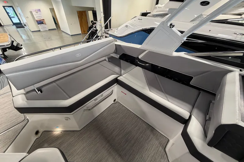 Slide: The Image of Interior of a 2022 Cobalt R6 Surf boat with sleek gray seating. - 12
