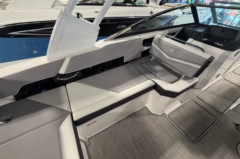 Slide: The Image of 2022 Cobalt R6 Surf boat interior with sleek gray seating and modern design. - 13