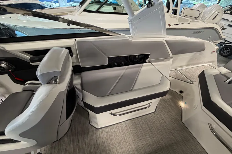 Slide: The Image of 2022 Cobalt R6 Surf boat interior with sleek gray seating and modern design. - 15