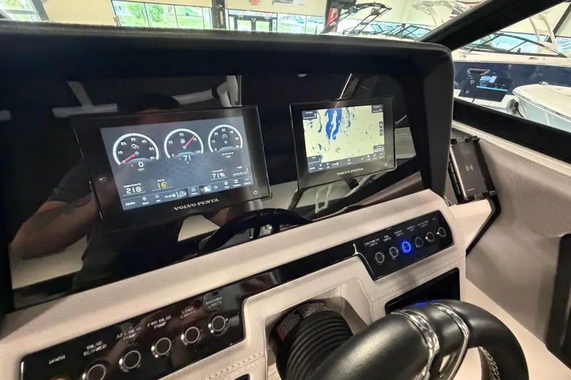 Slide: The Image of Dashboard of 2022 Cobalt R6 Surf boat with digital displays and controls. - 18