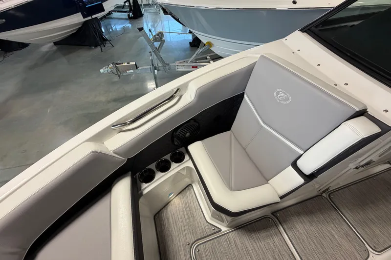 Slide: The Image of Interior of 2022 Cobalt R6 Surf boat with gray seating and cup holders. - 21