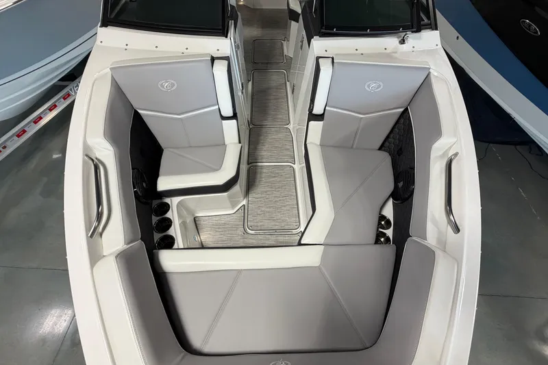Slide: The Image of 2022 Cobalt R6 Surf boat interior with gray seating and sleek design. - 24