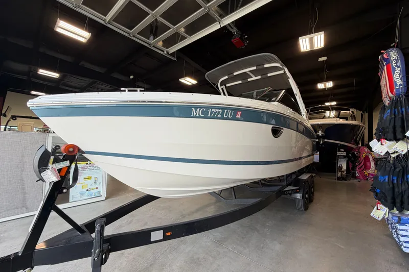 Slide: The Image of 2022 Cobalt R6 Surf boat displayed indoors on a trailer. - 3