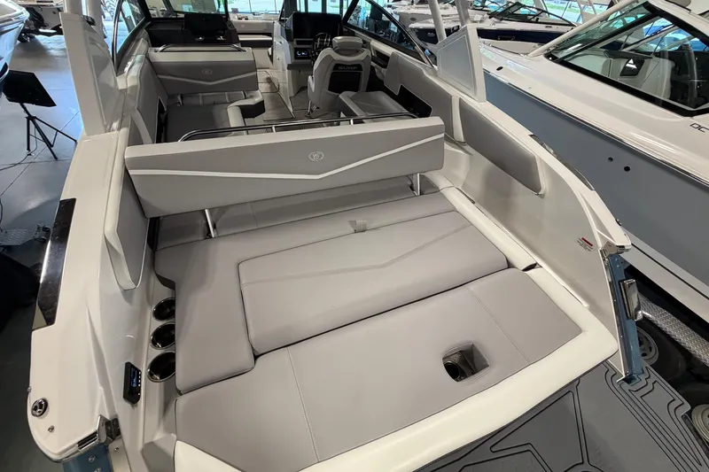 Slide: The Image of 2022 Cobalt R6 Surf boat interior with sleek gray seating and modern design. - 9