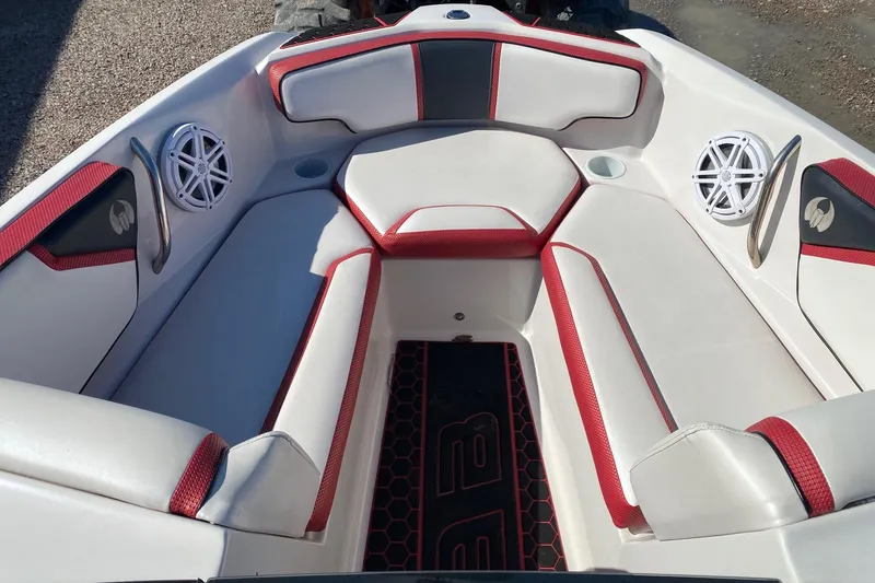 Slide: The Image of 2014 Scarab 195 H.O. Impulse boat interior with red and white seating and speakers. - 7