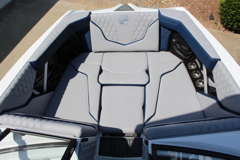 Slide: The Image of Luxurious interior of 2026 Tigé 22RZX boat with plush seating and cup holders. - 14