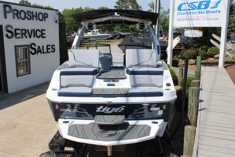 Slide: The Image of 2026 Tigé 22RZX boat displayed at Charlotte Ski Boats dealership. - 4