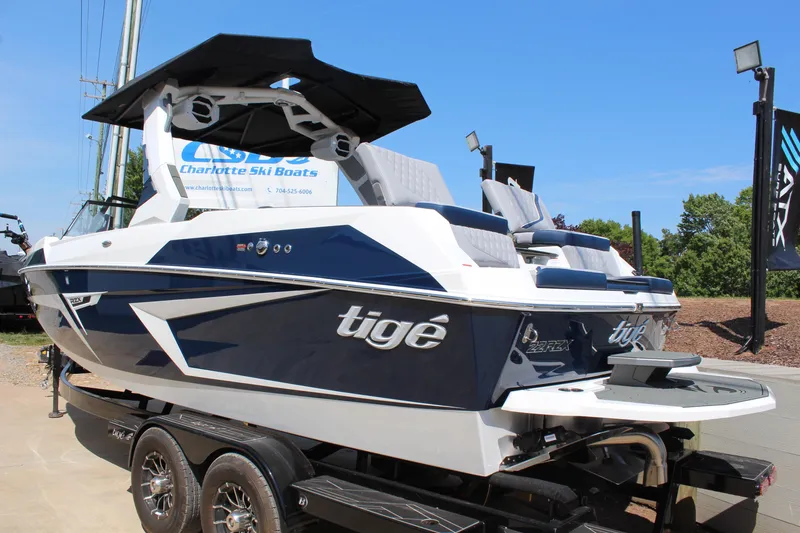 Slide: The Image of 2026 Tigé 22RZX boat with sleek design on a trailer at Charlotte Ski Boats. - 5