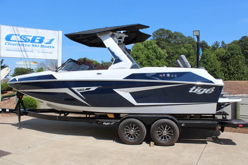Slide: The Image of 2026 Tigé 22RZX boat on trailer at Charlotte Ski Boats dealership. - 6