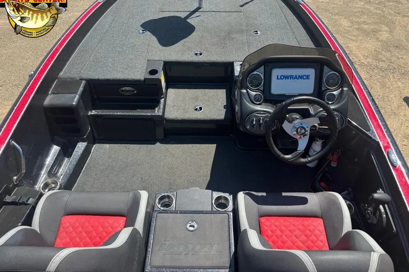 Slide: The Image of 2022 Triton 18 TrX boat interior with Lowrance display and red-accented seats. - 8