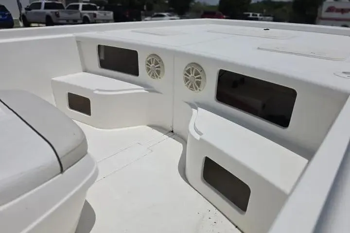 Slide: The Image of 2017 Mako Pro Skiff 21 CC interior with storage compartments and speakers. - 10