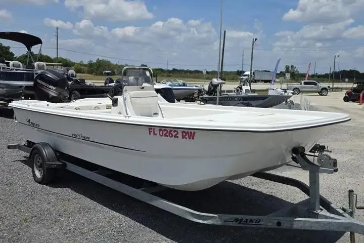 Slide: The Image of 2017 Mako Pro Skiff 21 CC boat on trailer in outdoor lot. - 7