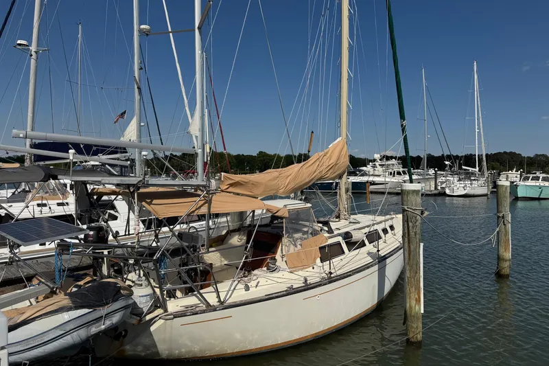 Slide: The Image of S2 36 sailboat from 1981 docked at a marina under clear blue skies. - 1