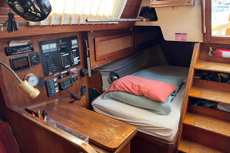 Slide: The Image of Cozy cabin interior of 1981 S2 36 sailboat with navigation panel and sleeping area. - 10
