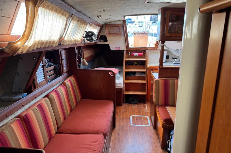 Slide: The Image of Interior of a 1981 S2 36 sailboat with cozy seating and wooden finishes. - 14