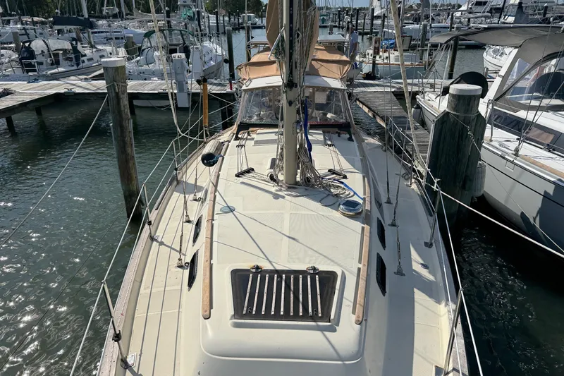 Slide: The Image of 1981 S2 36 sailboat docked at marina, surrounded by other boats. - 3