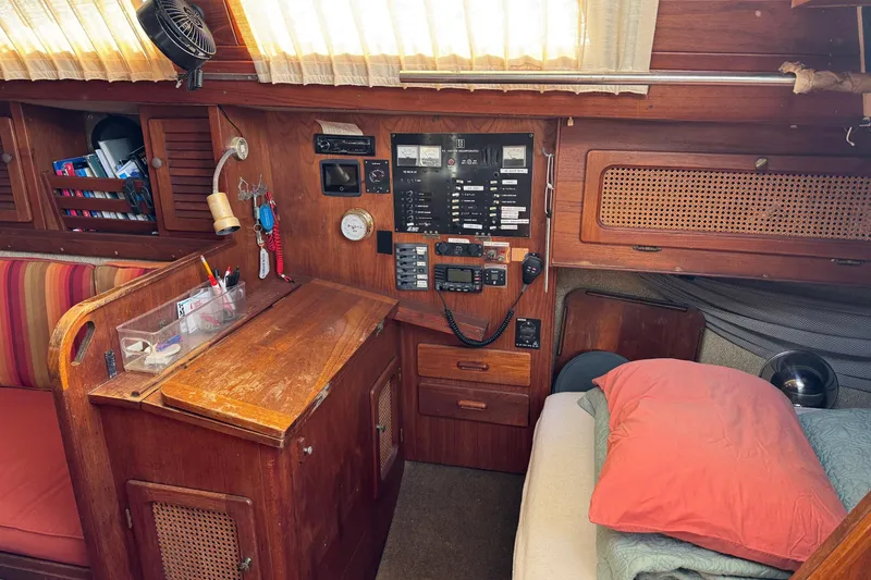 Slide: The Image of Cozy 1981 S2 36 sailboat cabin with navigation station and sleeping area. - 8