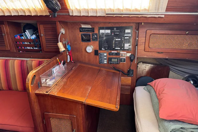 Slide: The Image of Interior of a 1981 S2 36 sailboat with navigation station and cozy seating area. - 9