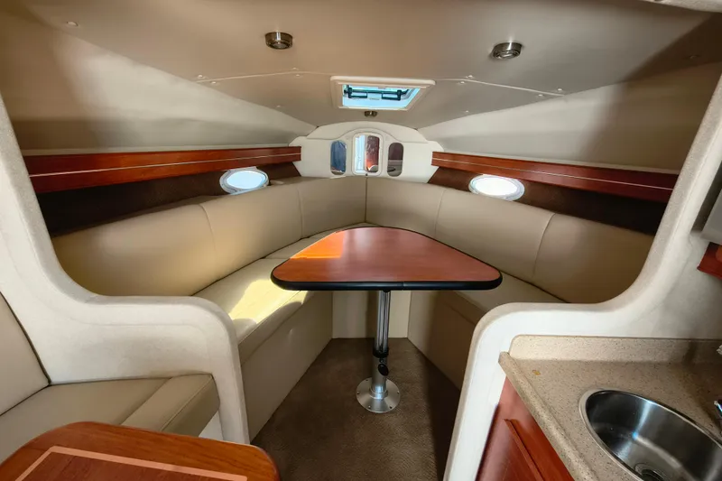 Slide: The Image of Interior of 2006 Rinker 300 Express Cruiser with seating and table. - 17