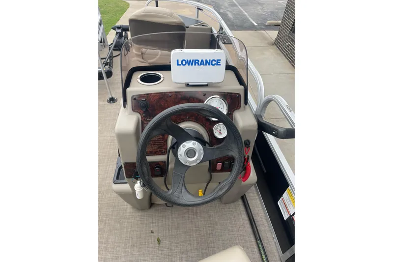 Slide: The Image of 2021 Sun Tracker Bass Buggy 18 DLX dashboard with Lowrance navigation system. - 4