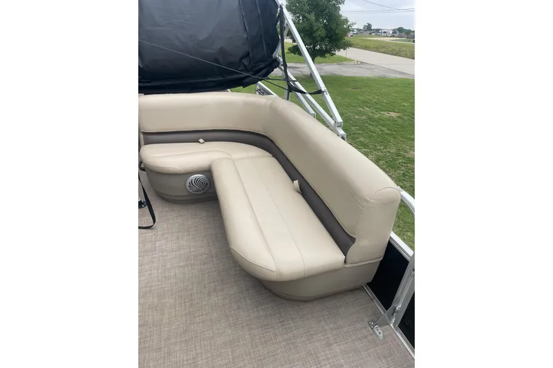 Slide: The Image of 2021 Sun Tracker Bass Buggy 18 DLX pontoon boat with beige seating and speaker. - 7