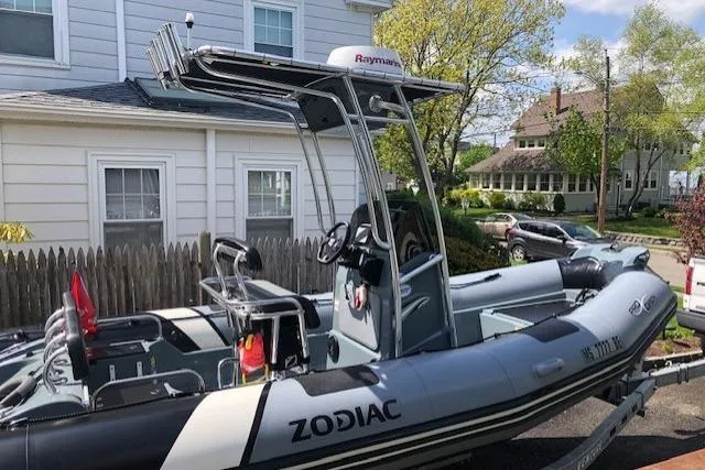 Slide: The Image of 2018 Zodiac Pro Open 650 boat parked in residential driveway. - 4