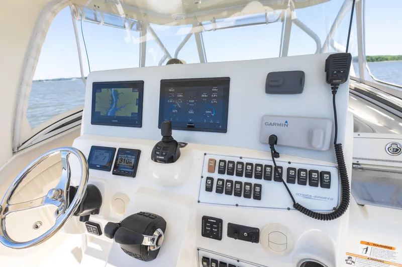 Slide: The Image of Control panel of a 2008 Hydrosport 3500 VX boat with Garmin navigation system. - 10