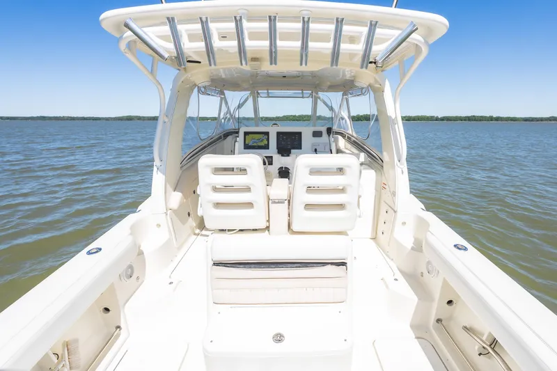 Slide: The Image of 2008 Hydrosport 3500 VX boat interior with dual seats on calm water. - 15