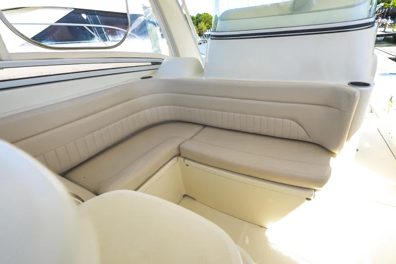 Slide: The Image of Luxurious seating area on a 2008 Hydrosport 3500 VX boat, featuring beige upholstery. - 17