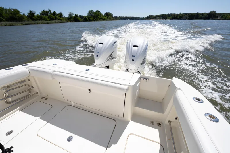 Slide: The Image of 2008 Hydrosport 3500 VX boat cruising on a river with twin V8 engines. - 19