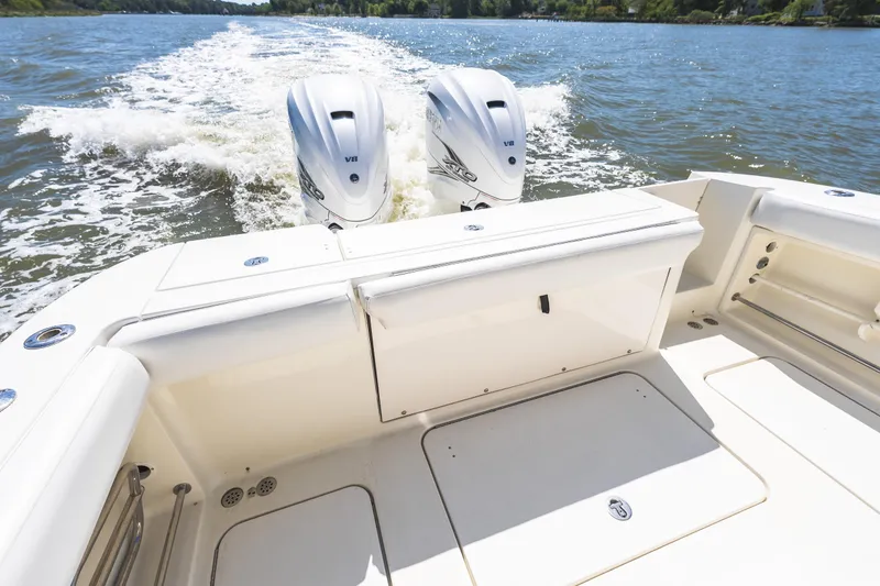 Slide: The Image of 2008 Hydrosport 3500 VX boat with dual engines cruising on a sunny day. - 20