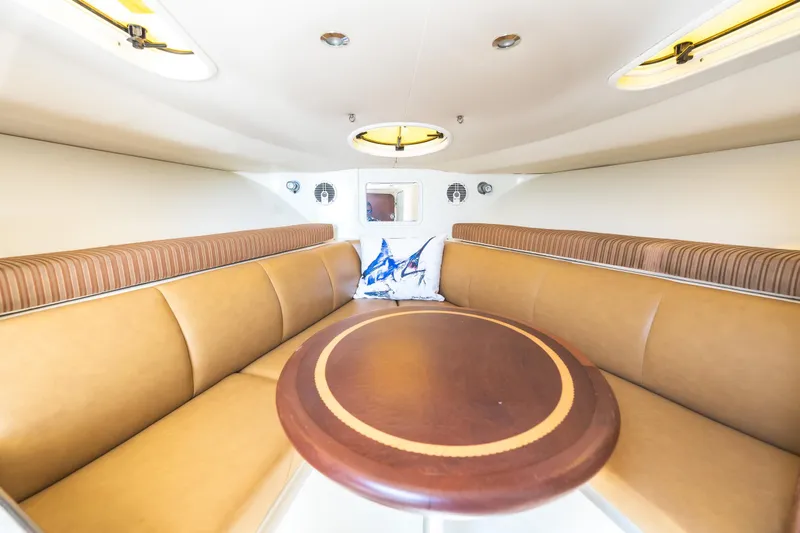 Slide: The Image of Luxurious interior of 2008 Hydrosport 3500 vx boat with plush seating and elegant table. - 26