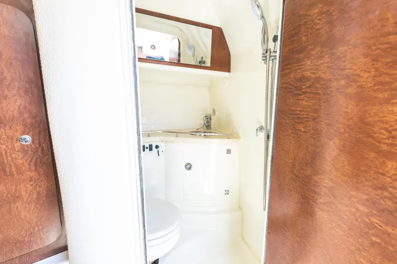 Slide: The Image of Interior of 2008 Hydrosport 3500 vx boat bathroom with sink and shower. - 27
